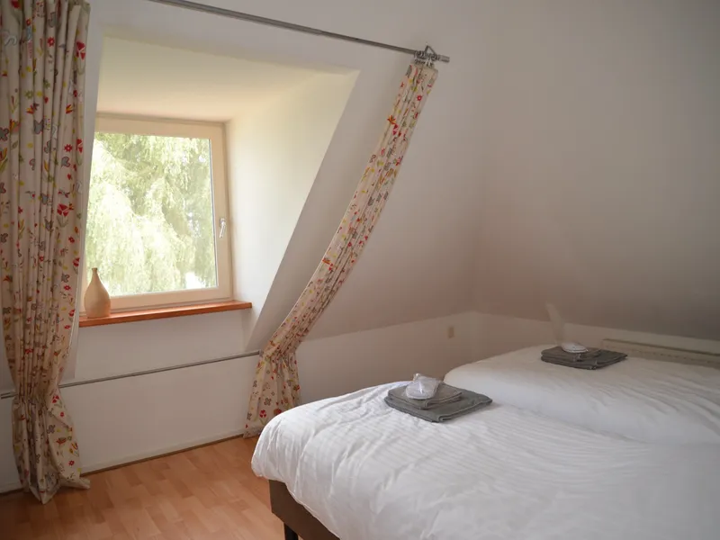 Slaapkamer met uitzicht over het land